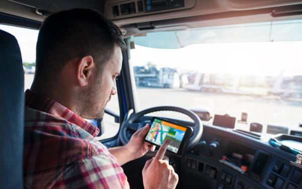 truck driver getting directions from tablet